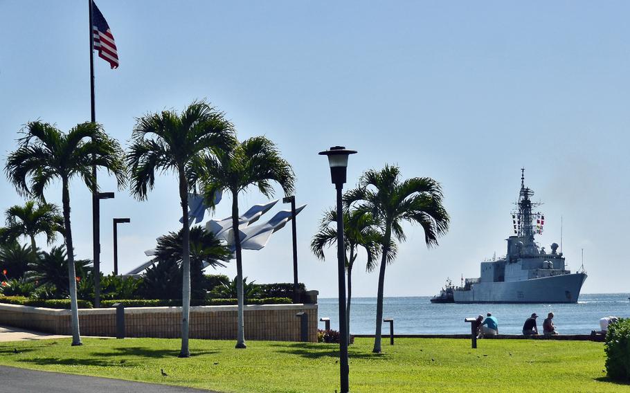 The Canadian destroyer HMCS Algonquin passes by the Missing Man Formation Memorial at Joint Base Pearl Harbor-Hickam, Hawaii, in February 2013.