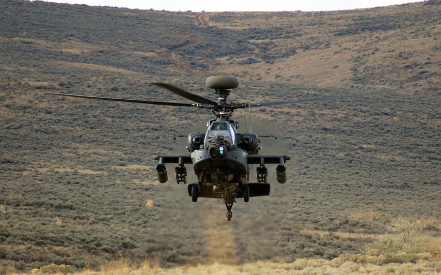 An Apache AH-64E attack helicopter is seen in this U.S. Army file photo. South Korean police said a AH-64 Apache helicopter crashed Monday, Nov. 23, 2015, on a road in Wonju, about 80 miles east of Seoul, killing 2 people on board. 