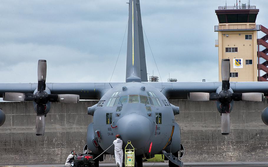 Supplies are transferred to a C-130 Hercules at Yokota Air Base, Japan, on Sept. 26, 2013. Security personnel at the base apprehended a suspect with a suspicious package who had gained unauthorized access to the base on Saturday, Dec. 23, 2015.