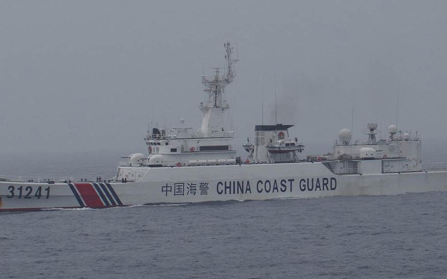 An armed Chinese coast guard vessel, like the one seen here, infringed on Japan's territorial waters on Jan. 8, 2016, and Dec. 26, 2015, prompting Japan's defense minister to threaten Japanese navy patrols in the area. Pictured is an armed Chinese coast guard vessel as it sails through Japan's contigious zone, Jan. 3, 2016.