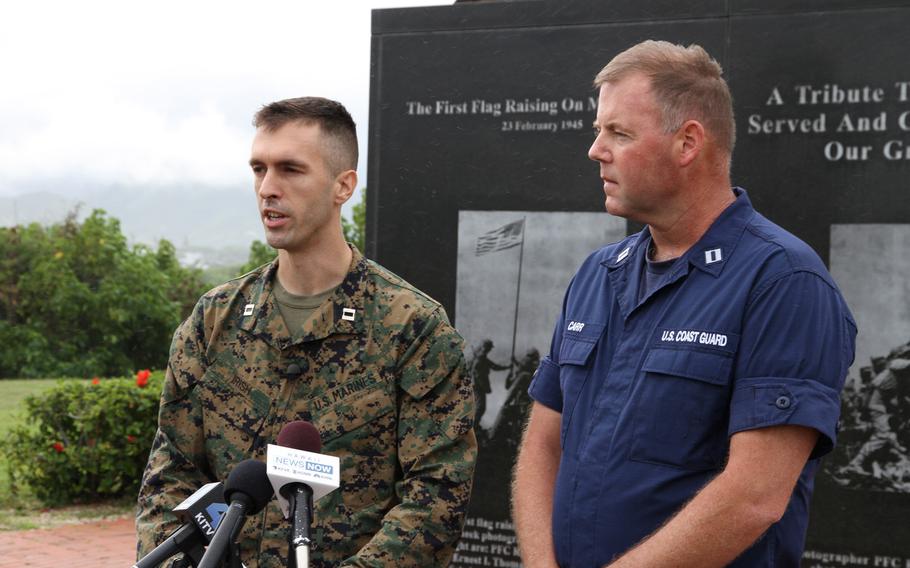 Marine Corps Capt. Timothy Irish, left, and Hawaii Coast Guard Lt. Scott Carr speak with reporters at Marine Corps Base Hawaii Friday about the search for 12 Marines missing from two helicopters that disappeared late Thursday night off Oahu's North Shore.

Wyatt Olson
Stars and Stripes