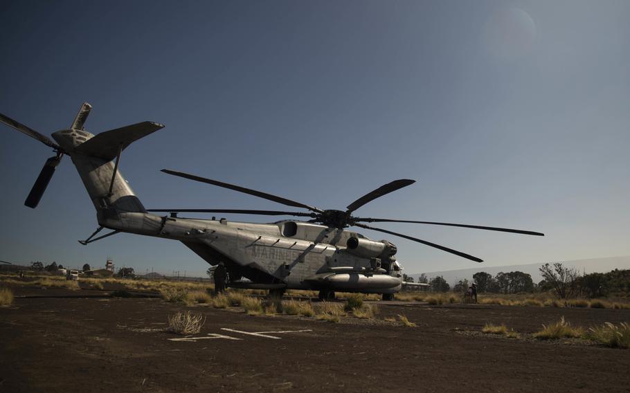 In this Jan. 14, 2015 file photo, Marines with Marine Heavy Helicopter Squadron 463 board a CH-53E Super Stallion as they prepare for takeoff  during exercise Lava Viper at Pohakuloa Training Area, Hawaii. The search for12 Marines missing from two CH-53E helicopters that disappeared late Thursday night off Oahu's North Shore has expanded.