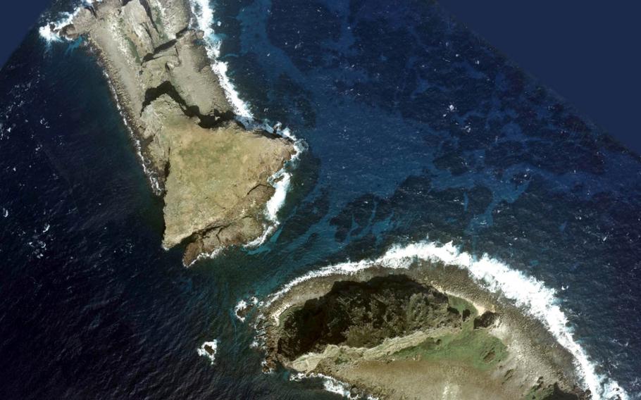An aerial photo of two Senkaku islands, Kita-Kojima, top, and Minami-Kojima. A spokesman for China's Defense Ministry reiterated previous government assertions that China does not recognize Japan's claims to the disputed Senkaku Islands — called Diaoyu by the Chinese — and would continue to traverse Japanese waters. 