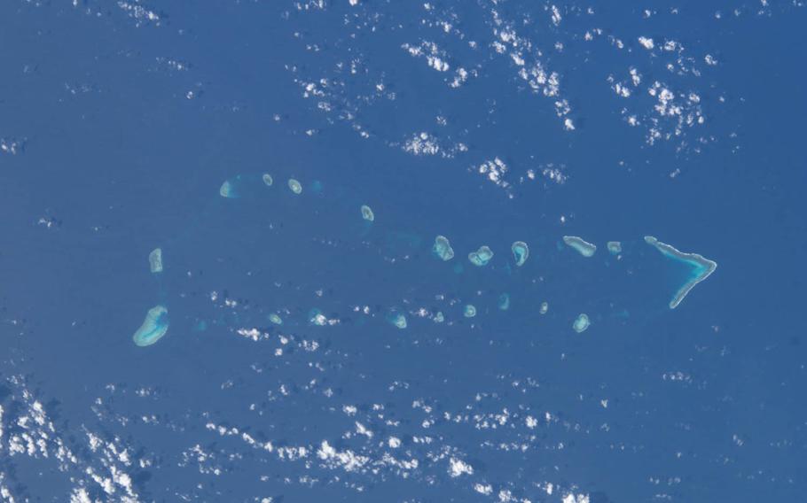 This photo taken from the International Space Station shows the South China Sea along with Eldad Reef and Itu Aba Island, features of the disputed Spratly chain. The sea is in danger of becoming “virtually a Chinese lake” by 2030, capable of “overawing … lesser powers" warns a new study from the Center for Strategic and International Studies in Washington, D.C.