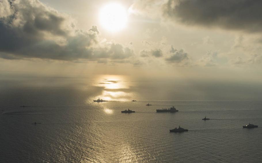 Ships and submarines from the U.S. and Singapore navies gather in formation last summer during Cooperation Afloat Readiness and Training in the South China Sea. A Washington-based think tank study warns the regional balance of power in the Pacific is slipping away from the U.S. because President Barack Obama's "pivot" to Asia has been hampered by budget cuts, lack of clear policy goals and China's willingness to take risks to assert territorial claims.