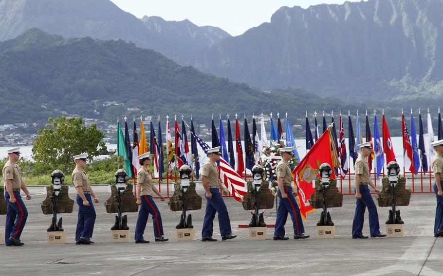 During a memorial at Marine Corps Base Hawaii on Jan. 22, 2016, an honor guard marches away from 12 crosses after placing a pair of boots on each in memory of the dozen Marines who died Jan. 14 in helicopter crashes in Hawaii.

Wyat Olson
Stars and Stripes