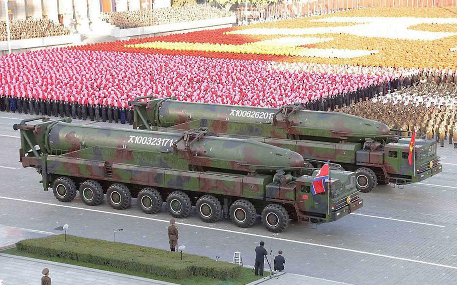 This screenshot from the Korean Central News Agency shows a new version of North Korea's KN-08 intercontinental ballistic missile, publicly displayed during an October military parade. A Japanese government official says the North could launch a long-range ballistic missile as early as next week, according to Japan's Kyodo news agency.