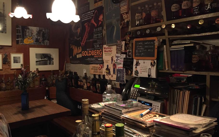 La Jetee hasnt changed much since Tomoyo Kawai opened the bar in 1974: Same wooden bench seats and tables. Same light fixtures. Same abstract sculpture-like shelves holding countless bottles of Nikka Black and Pure Malt Red whisky.