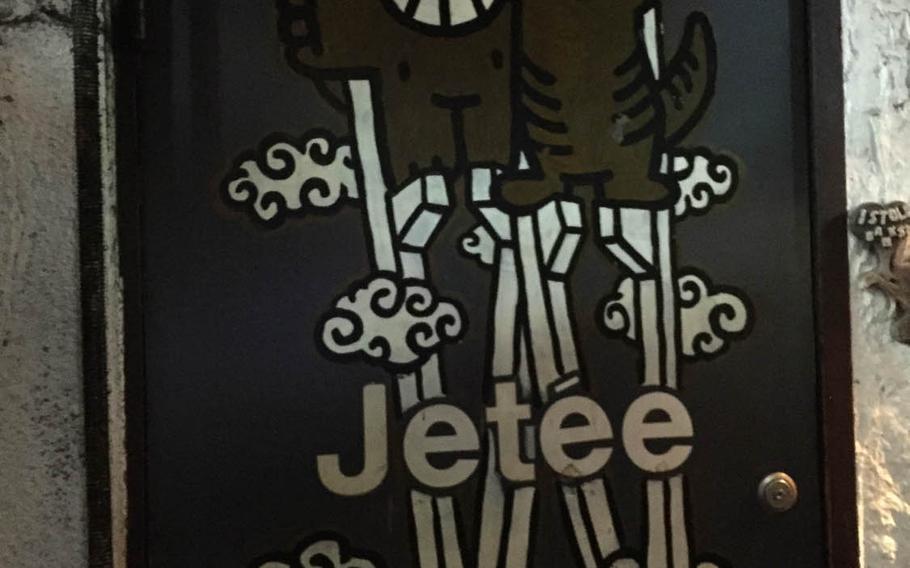 A drawing of cats on stilts marks the entrance to La Jetee, an icon Tokyo bar where owner/cinephile Tomoyo Kawai has been pouring stiff drinks and serving tasty bites for more than 40 years. Kawai counts entertainment heavy weights Francis Ford Coppola, Quentin Tarantino and Johnny Depp among her repeat customers, though she insists her place, which was featured in the 1983 cult-classic documentary "Tokyo-Ga" by German filmmaker Wim Wenders, is "not famous."