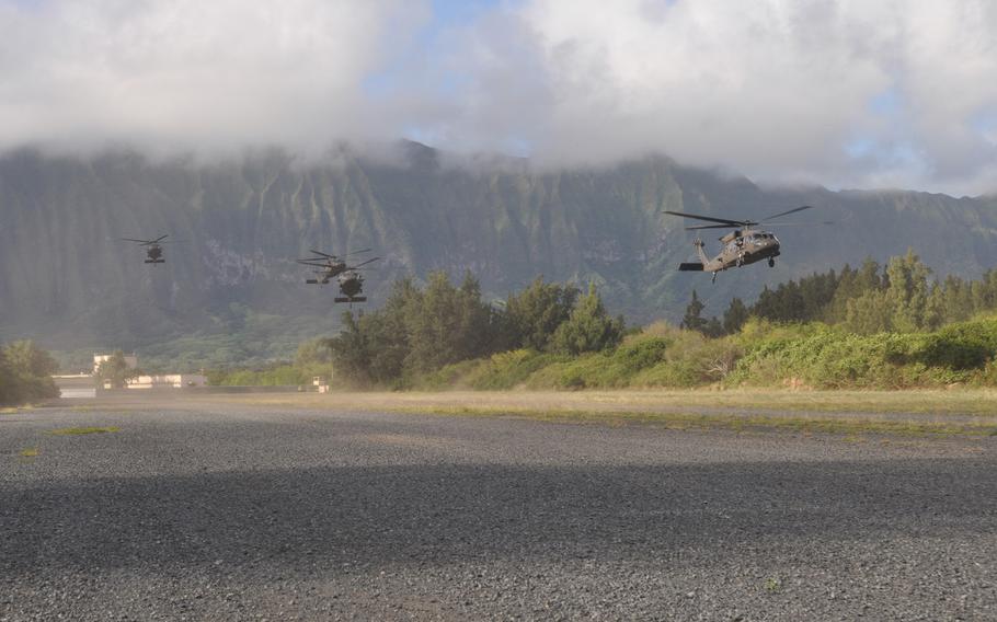 Army Blackhawk helicopters arrive at Marine Corps Training Area Bellows in Hawaii Feb. 5, 2016, during an air assault for Exercise Lightning Forge.

Wyatt Olson
Stars and Stripes