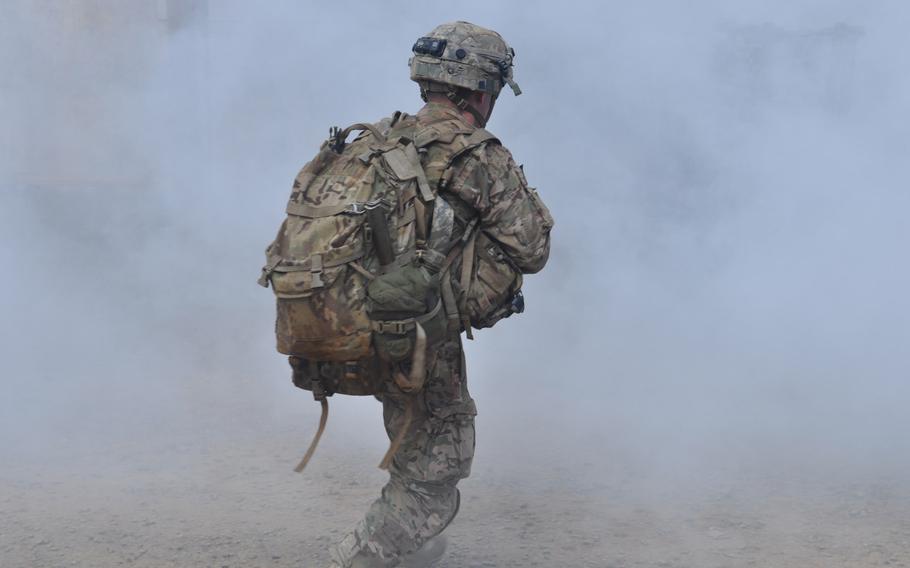 A soldier rushes through a smoke screen into the unknown during a mock raid on a terrorist stronghold during Exercise Lightning Forge, Feb. 5, 2016, at Marine Corps Training Area Bellows, Hawaii.

Wyatt Olson
Stars and Stripes