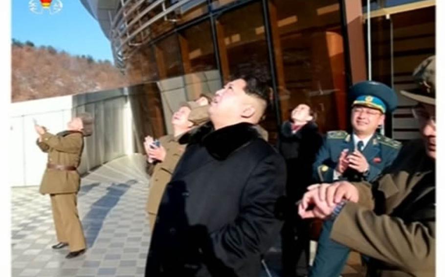 This screenshot from a Korean Central Television broadcast purports to show North Korean leader Kim Jong Un and other officials watching a missile launch, Sunday, Feb. 7, 2016. 