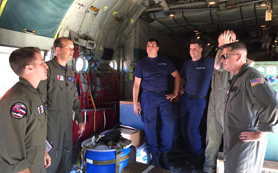 A Coast Guard HC-130 Hercules airplane crew conducts a pre-flight brief prior to launching from Air Station Barbers Point in response to a report of 40 people abandoning ship south of the Hawaiian Islands, Feb. 10, 2016. 

