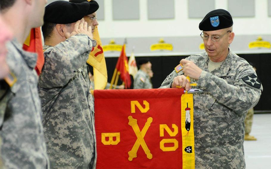 Maj. Gen. Theodore D. Martin, 2nd Infantry Division commander, presents Bravo Battery, 2nd Battalion, 20th Field Artillery Regiment with an Honors Feather during a ceremony at Camp Casey, South Korea, Wednesday, Feb. 10, 2016. 2nd Battalion is headed home to Fort Hood, Texas, while 3rd Battalion, 13th Field Artillery Regiment, 75th Fires Brigade at Fort Sill, Okla., will serve under 2nd ID's 210th Field Artillery Brigade for the next nine months.