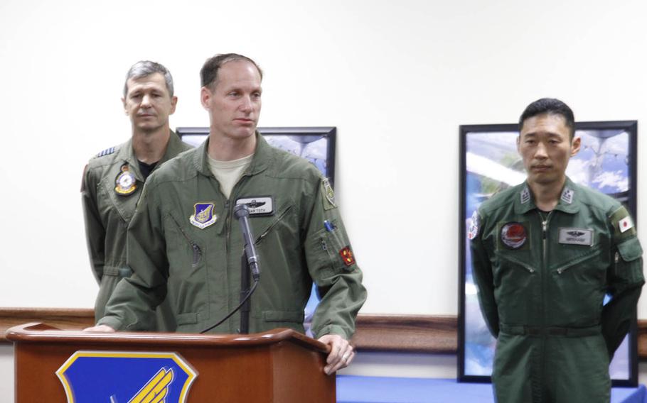 Col. Brian E. Toth, exercise commander for U.S. forces at Cope North 16, speaks with reporters Wednesday, Feb. 17, 2016, at Andersen Air Force Base, Guam. In the background are Group Capt. Glen Braz, left, commander of the Australian exercise units, and Col. Takuya Watanabe, exercise lead for the Japan Air Self-Defense Force.  