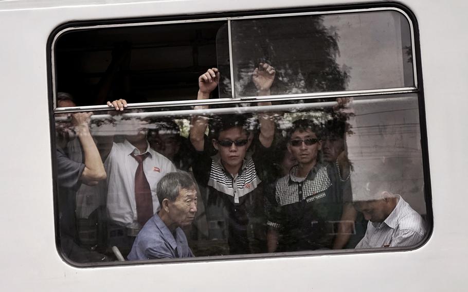 Commuters ride a crowded city trolley in Pyongyang, North Korea, in September 2015. The gap between the haves and the have-nots in North Korea is hard to ignore, even in the capital.