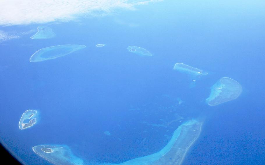 An aerial view of islands in the Paracel chain in the South China Sea. China has made it clear it won't accede to U.S. calls for an end to construction on the sea's islands, rocks and reefs, which are claimed by six governments in the region.  Nor will China stop arming those islands. 
