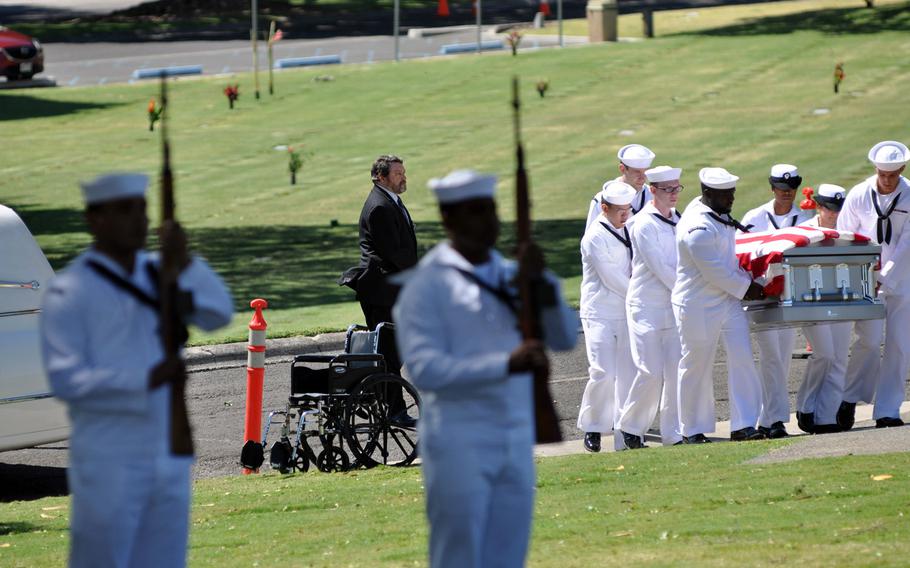 Sailors carry the casket of Petty Officer 1st Class Vernon T. Luke, a  USS Oklahoma crew member who died in the Japanese surprise attack of 1941, to a funeral held March 9, 2016, at the National Memorial Cemetery of the Pacific in Honolulu.