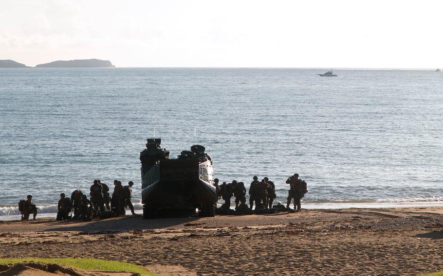 Marines unload from an Amphibious Assault Vehicle during a simulated assault in 2014 at Oura Wan Beach near Camp Schwab, Okinawa. A Marine assigned to Marine Corps Installations Pacific was found dead off the coast of Camp Schwab, Monday, March 28, 2016.