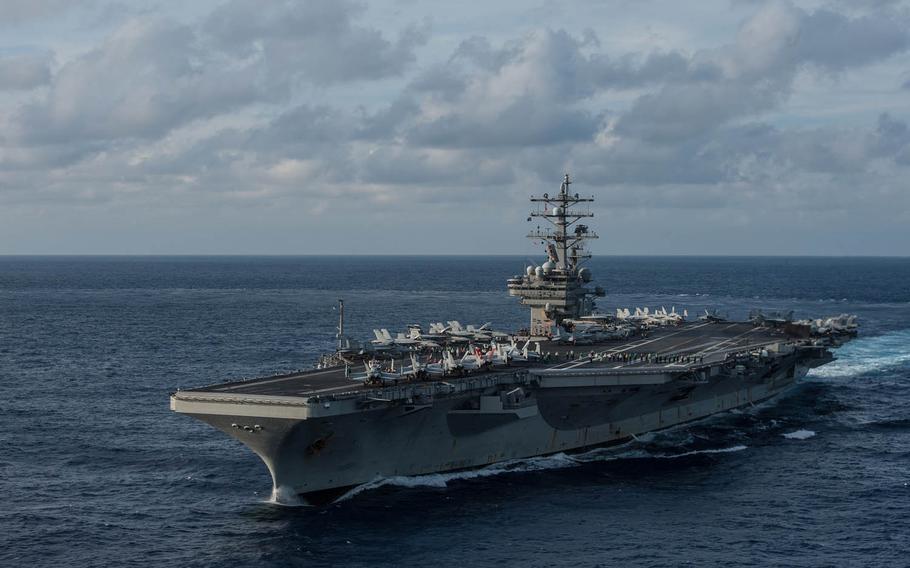 The U.S. Navy's only forward-deployed aircraft carrier USS Ronald Reagan transits the Philippine Sea in November. Navy Capt. Michael Donnelly, known affectionately as Buzz, took command of the ship Tuesday, April 12, 2016, at Yokosuka Naval Base, Japan.