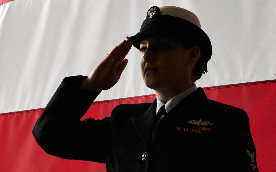 A sailor salutes during a change-of-command ceremony aboard the aircraft carrier USS Ronald Reagan, Tuesday, April 12, 2016, at Yokosuka Naval Base, Japan.