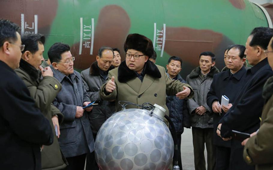 North Korean leader Kim Jong Un is seen in front of what the North claims to be a miniaturized nuclear warhead in this undated photo from the Korean Central News Agency. U.S. Deputy Secretary of State Anthony Blinken warned Tuesday that the international community would respond to any further nuclear weapons testing by North Korea. 