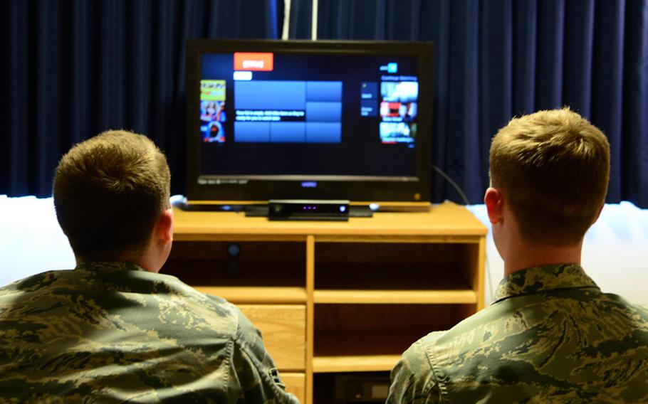 Airmen search through an online streaming service.
