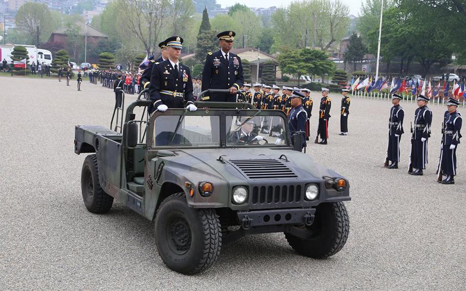 Gen. Curtis M. Scaparrotti, left, and Gen. Vincent K. Brooks, inspect the troops during a change of command ceremony on Knight Field, South Korea, April 30, 2016.
