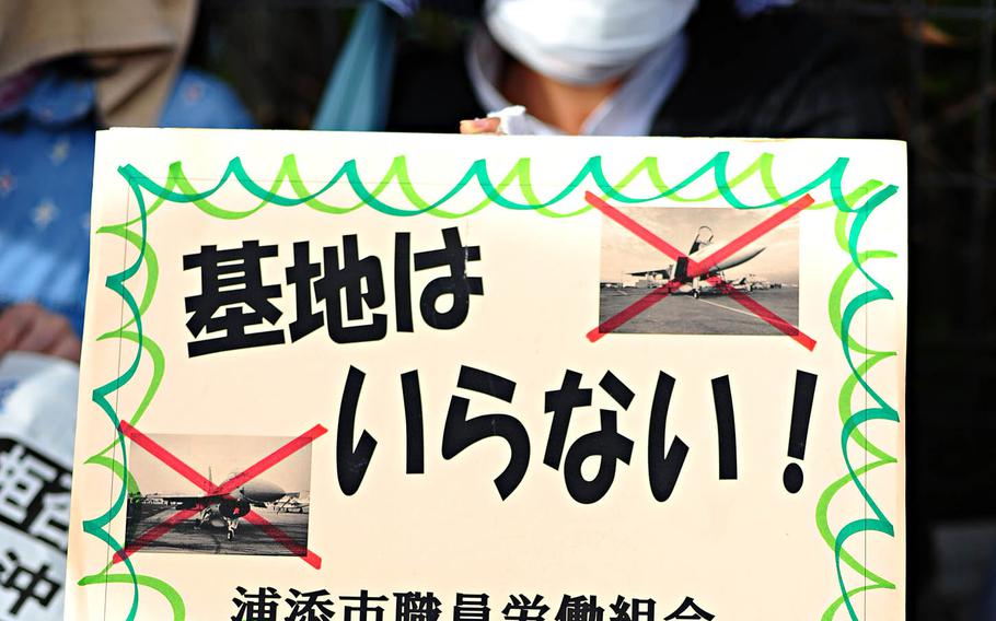 A man protests the relocation of Marine Corps Air Station Futenma in this undated photo. In a sign that further delays can be expected in the relocation to Camp Schwab, the Japanese government began removing floats meant to block seaborne protesters from the construction area of a new runway into Oura Bay.