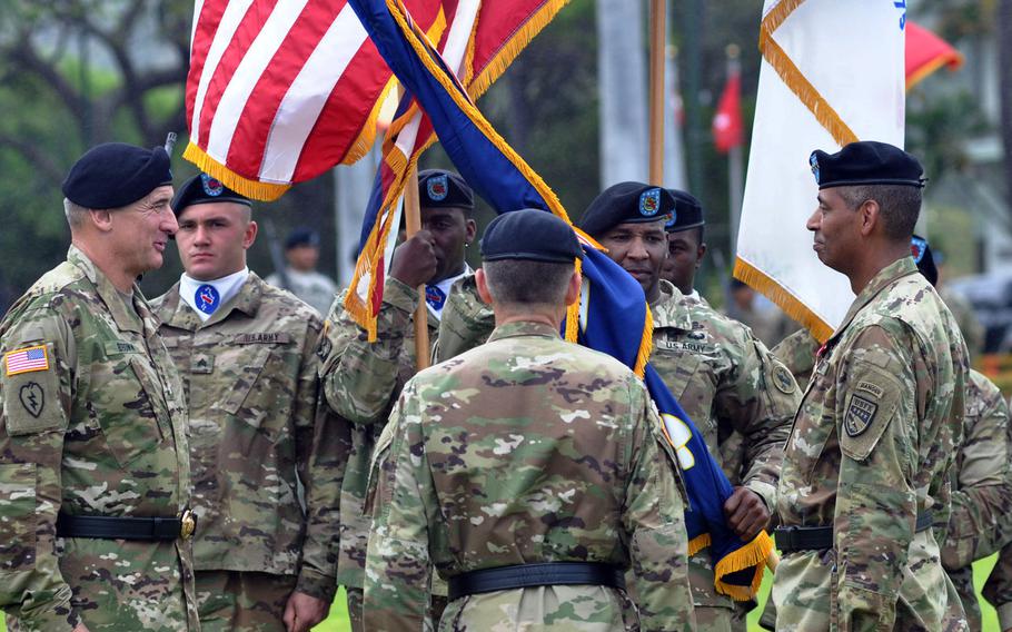 Gen. Vincent Brooks, far right, passes the colors for U.S. Army Pacific to Gen. Robert B. Brown, far left, during a change of command ceremony at Fort Shafter, Hawaii, Wednesday, May 4, 2016. Brown, who was given his fourth star shortly before the ceremony, most recently served as commanding general of the U.S. Army Combined Arms Center at Fort Leavenworth, Kansas.