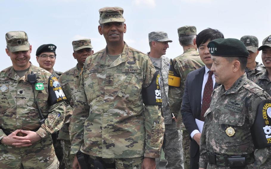 Gen. Vincent Brooks, U.S. Forces Korea commander, and Gen. Lee Soon-jim, of the South Korean joint chiefs of staff, look out at North Korea from Outpost Ouellette at the Demilitarized Zone that divides the Korean Peninsula Thursday, May 12, 2016. The U.S. and South Korea will be joined by Japanese forces next month in an anti-missile exercise aimed at countering any potential missile launches from North Korea. 