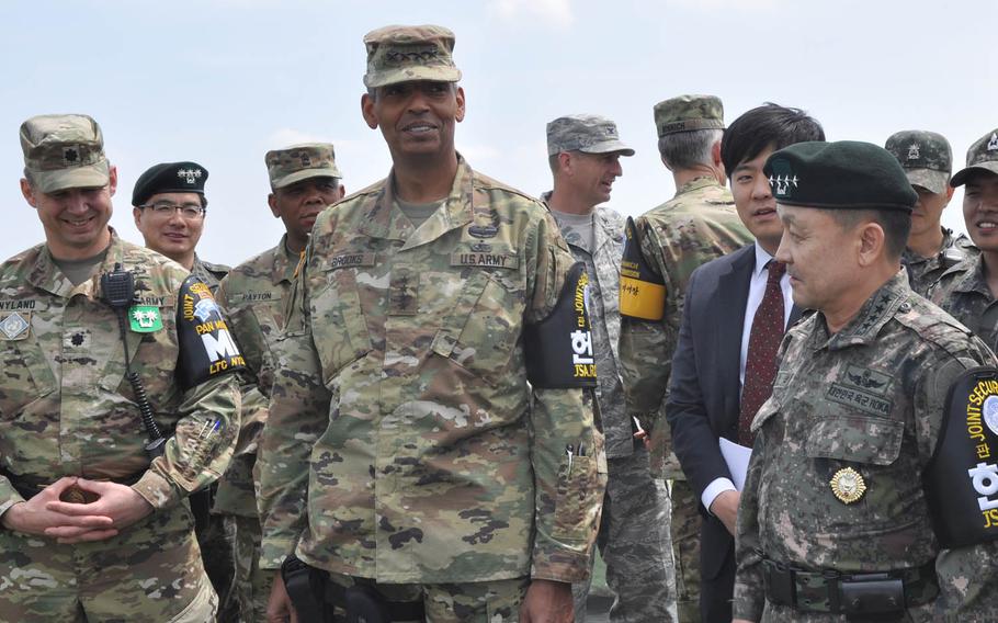 Gen. Vincent Brooks, U.S. Forces Korea commander, and Gen. Lee Soon-jim, of the South Korean joint chiefs of staff, look out at North Korea from Outpost Ouellette at the Demilitarized Zone that divides the Korean Peninsula Thursday, May 12, 2016. The U.S. and South Korea will be joined by Japanese forces next month in an anti-missile exercise aimed at countering any potential missile launches from North Korea.