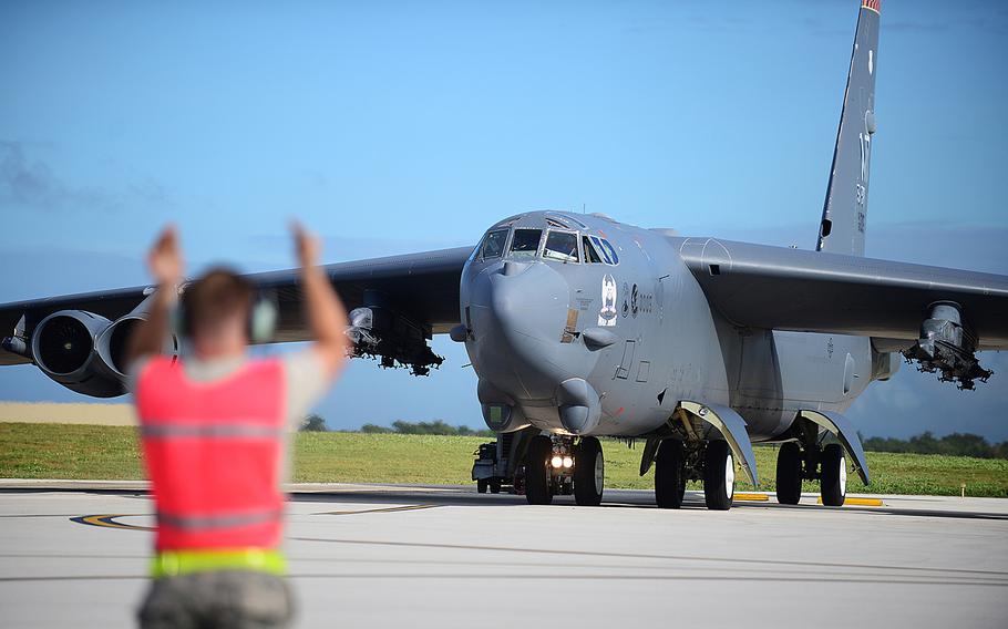 A U.S. airman directs a B-52 Stratofortress at Andersen Air Force Base, Guam, March 21, 2016. 

Joshua Smoot
U.S. Air Force