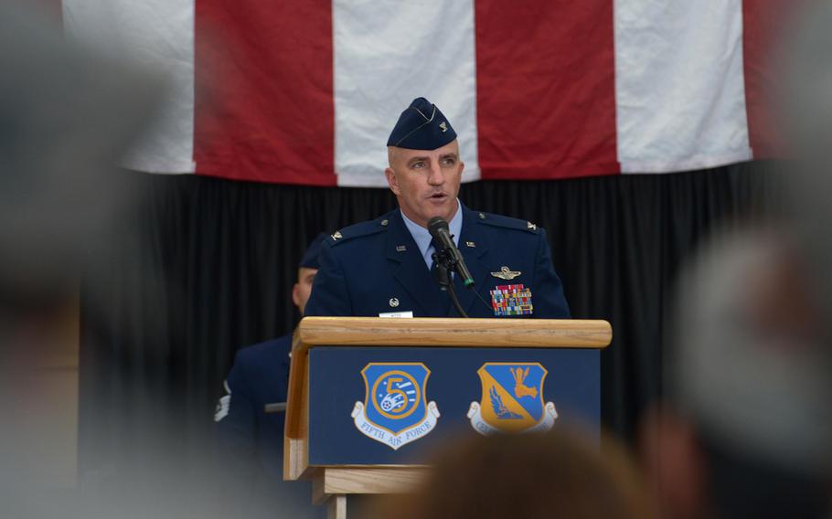 Col. Kenneth Moss, 374th Airlift Wing incoming commander, speaks to members of the audience during the official wing change of command at Yokota Air Base, Japan, on Friday, June 24, 2016. 