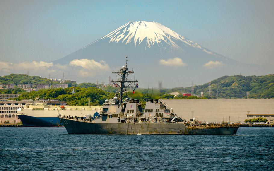 The guided-missile destroyer USS Barry sails past Mount Fuji en route to Yokosuka Naval Base, Japan, May 13, 2016. Navy officials announced Monday, July 11, 2016, that sailors in Japan are once again allowed to drink alcoholic beverages off base until midnight after more than a month of restrictions stoked by a series of arrests involving servicemembers and base civilians.