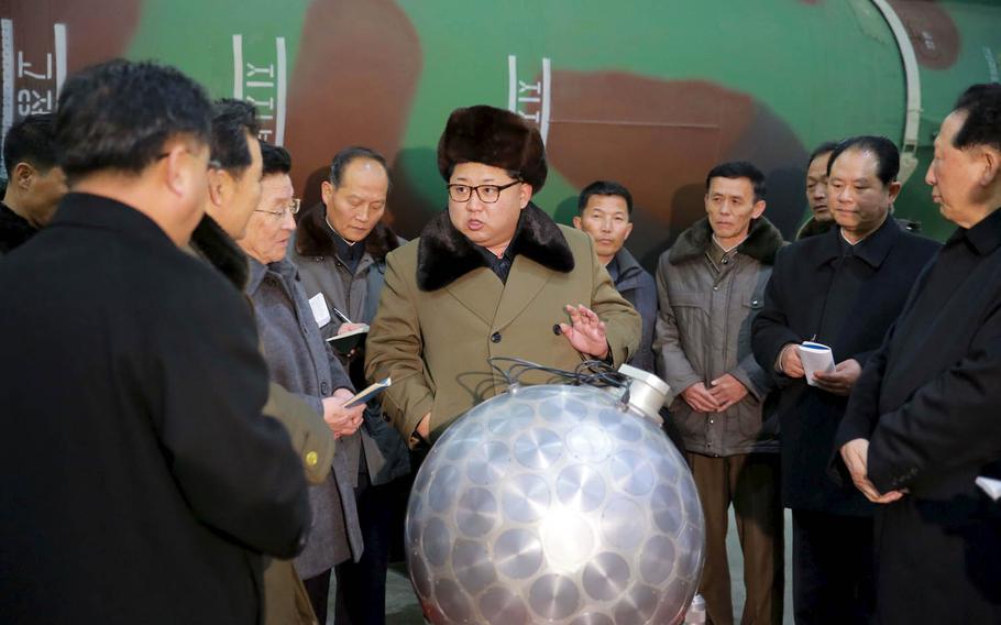In March 2016, North Korea's Rodong Sinmun newspaper published photos purporting to show leader Kim Jong Un and the country's nuclear scientists standing near what some analysts said appears to be a model nuclear warhead with a ballistic missile, or a model of one, in the background.