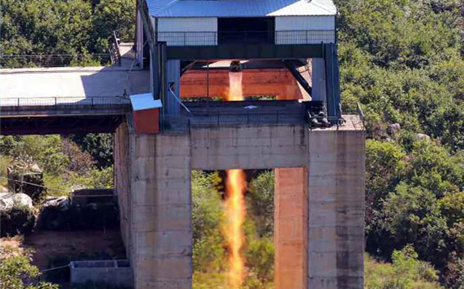This photo published in the Tuesday, Sept. 20, 2016, edition of the official Rodong Sinmun newspaper purports to show a successful rocket-engine test attended by North Korean leader Kim Jong Un. 