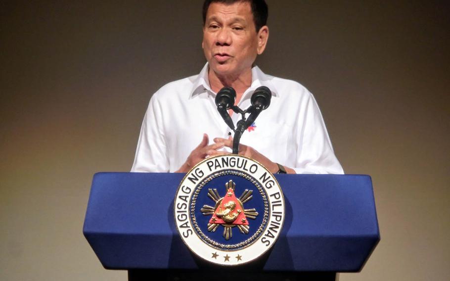 Philippine President Rodrigo Duterte speaks to the Philippine Economic Forum in Tokyo, Wednesday, Oct. 26, 2016. Duterte said he wants to end his nation's reliance on foreign military assistance.