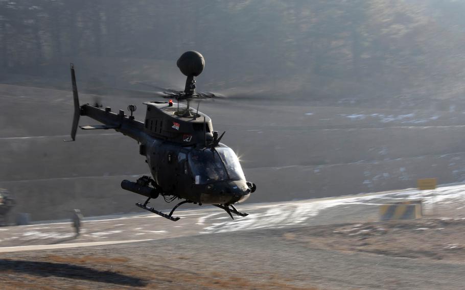 A OH-58 Kiowa helicopter takes off and flies toward a Rodriguez Live Fire Range, South Korea, Wednesday, Jan. 25, 2017. The exercise was the final time the OH-58 Kiowa was used by the Army before being decommissioned from active use.