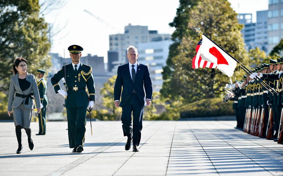 Defense Secretary Jim Mattis walks with Japanese Minister of Defense Tomomi Inada during a pass and review at the Defense Ministry in Tokyo, Saturday, Feb. 4, 2017.