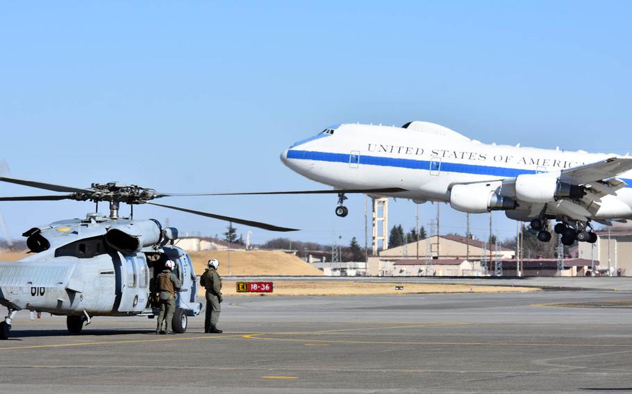 A plane carrying Secretary of Defense Jim Mattis lands at Yokota Air Base, Japan, Friday, Feb. 3, 2017. It's Mattis' first visit to Japan as Pentagon chief.