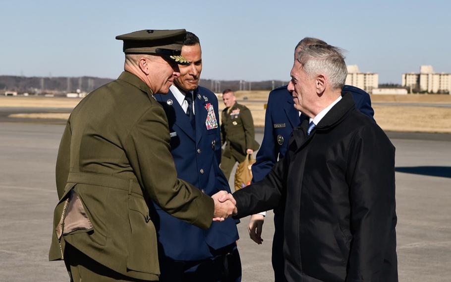 Defense Secretary Jim Mattis shakes hands with the command team of the United States Forces Japan during Mattis' trip to Tokyo, Japan, Feb. 3, 2017.