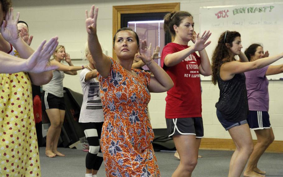 Riza Walker, second from left, dances during a hula class on Kwajalein Island.
