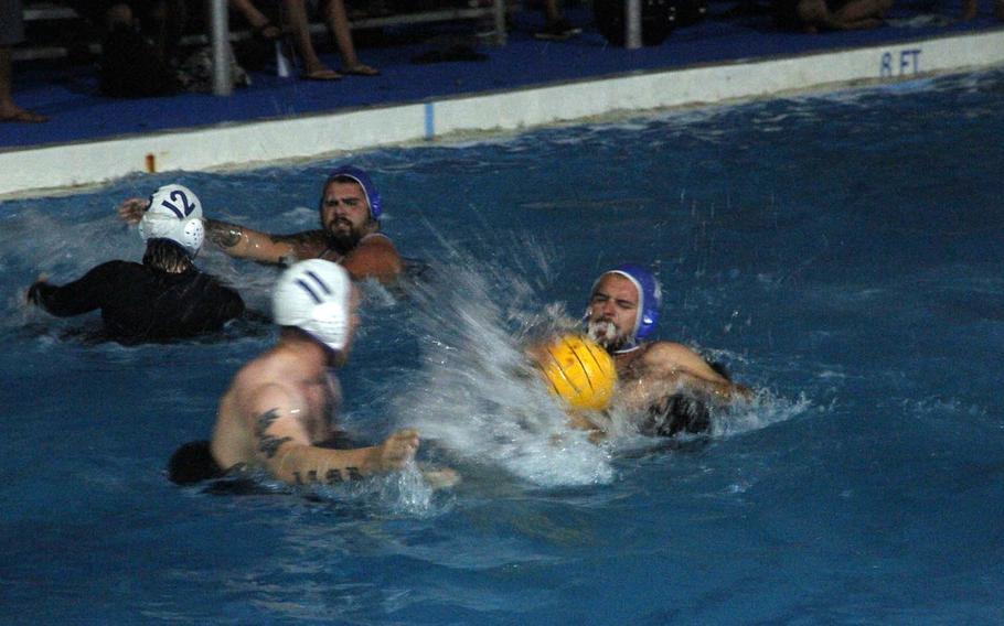 Polo Loco takes on Tyler's Angels during an evening game of water polo, one of a plethora of organized events that keep residents of the tiny island of Kwajalein busy.
