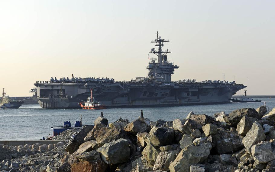 The Nimitz-class aircraft carrier USS Carl Vinson pulls into Busan, South Korea, Wednesday, March 15, 2017. 