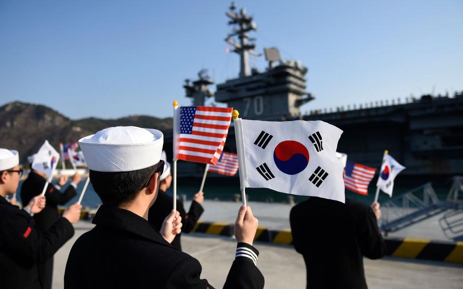 South Korean sailors welcome the USS Carl Vinson last month to Busan, South Korea. Adm. Harry Harris, head of U.S. Pacific Command, recently directed the aircraft carrier and its accompanying fleet to sail north from Singapore instead of heading for planned port visits in Australia.