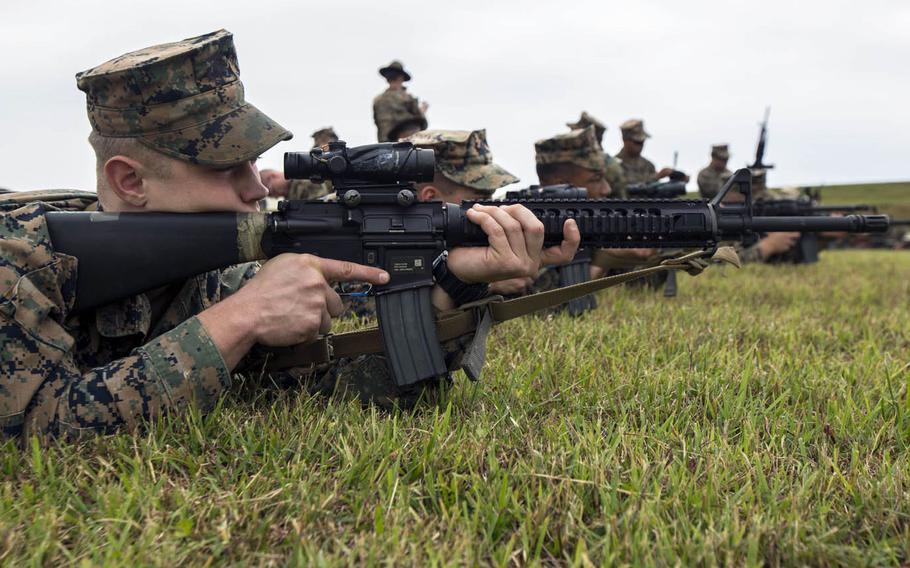 Marines participate in the Competition in Arms Program last year at Camp Hansen, Okinawa, Japan.