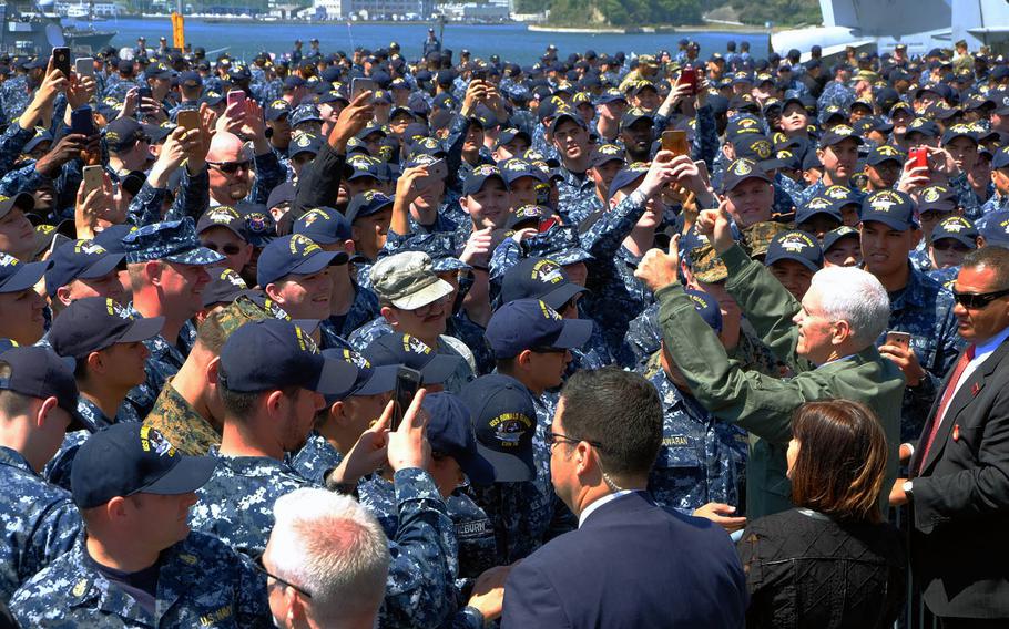 Vice President Mike Pence greets servicemembers aboard the USS Ronald Reagan after his speech, Wednesday, April 19, 2017.