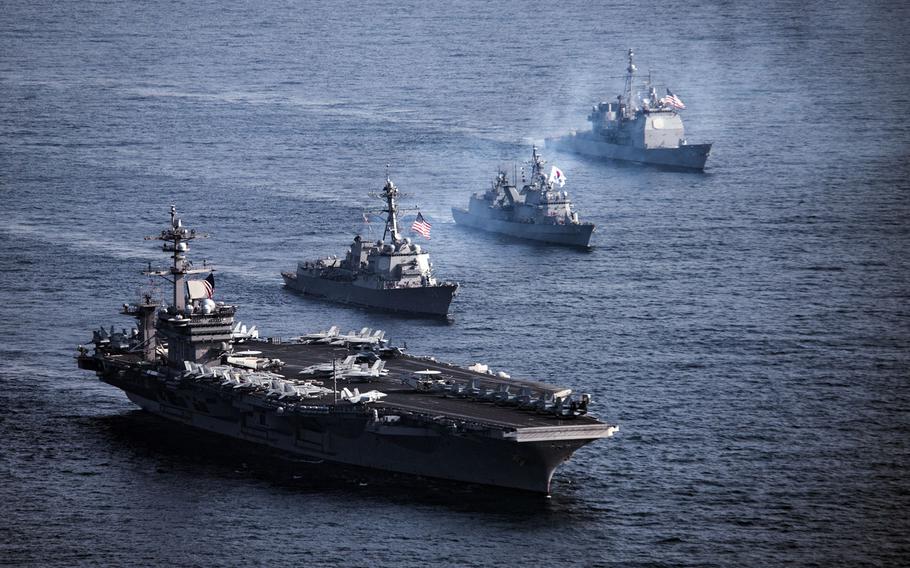Elements of the USS Carl Vinson strike group trained with allies west of the Korean peninsula and south of Japan in March.