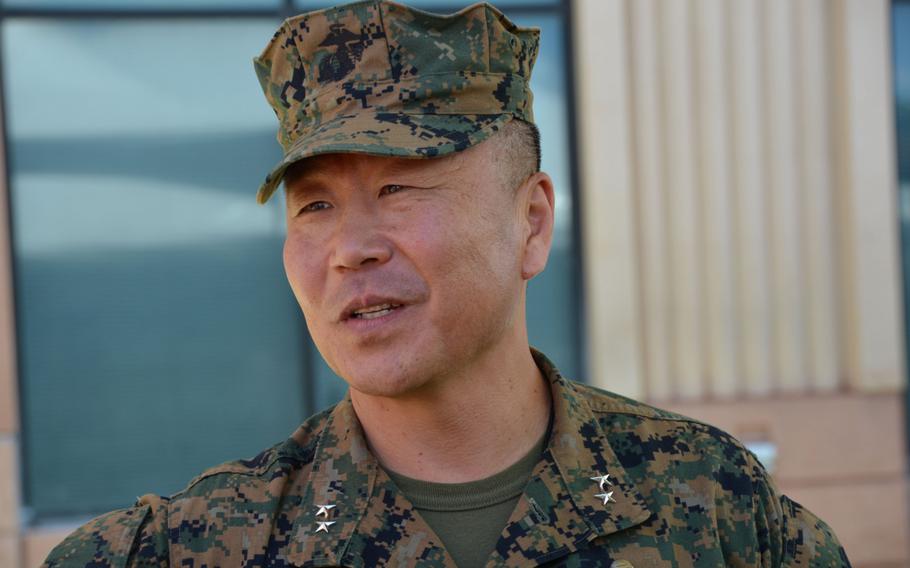 Maj. Gen. Daniel Yoo speaks with a well-wisher after taking command of Pacific Special Operations during a ceremony at Camp H.M. Smith, Hawaii, Friday, May 12, 2017.